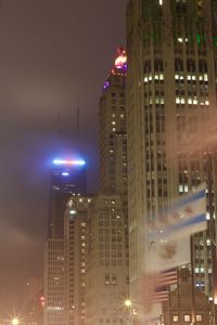 Low angle view of modern building against sky at night