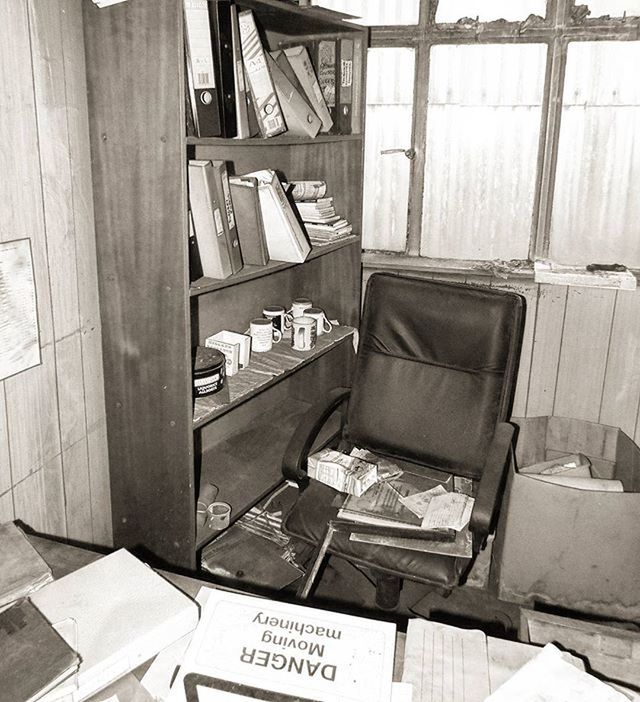 text, transportation, built structure, indoors, abandoned, day, empty, no people, mode of transport, architecture, wood - material, western script, absence, obsolete, chair, old, communication, damaged, window