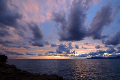 Scenic view of sea against sky at sunset