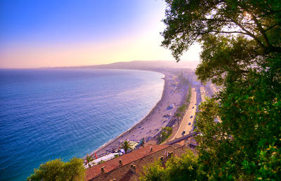 High angle view of beach against sky during sunset