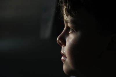 Close-up of boy looking away