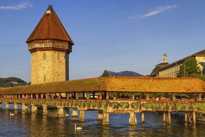 Kapellbrucke chapel covered bridge and water tower in luzern by day, switzerland