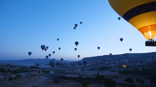 Low angle view of hot air balloons against sky