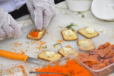 High angle view of person preparing food on table