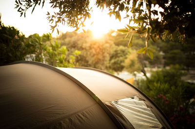 Close-up of tent against sky during sunset