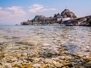 View of beach with city in background