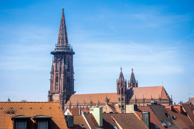 Low angle view of buildings against blue sky