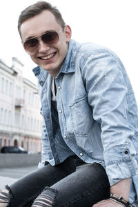 Smiling young man wearing sunglasses