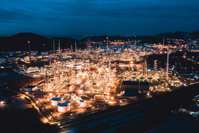 High angle view of illuminated buildings in city at night