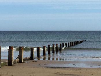 View of pier on sea against sky