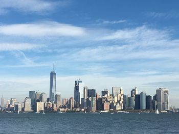 Sea with skyscrapers in background