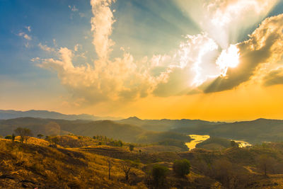 Scenic view of landscape against sky during sunset