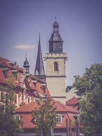 Low angle view of bell tower against sky