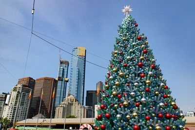 Low angle view of christmas tree against sky