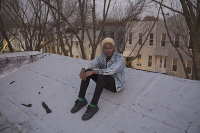 A young man on a rooftop