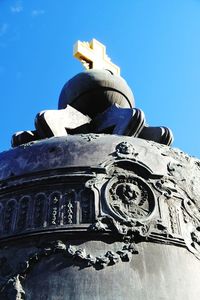 Low angle view of sculpture against blue sky