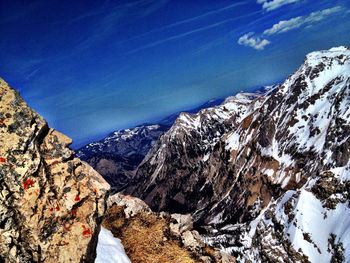 Scenic view of mountains against cloudy sky