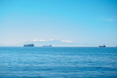 Scenic view of sea against blue sky