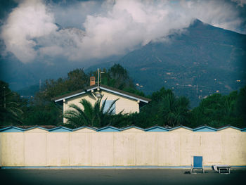 House against foggy mountain