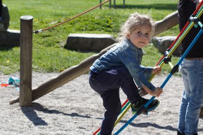 Portrait of happy girl playing in playground