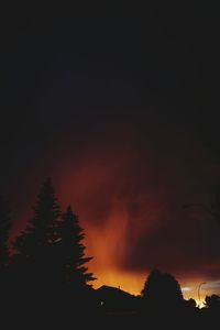 Silhouette of trees against sky at sunset