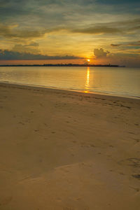 Scenic view of calm sea at sunset