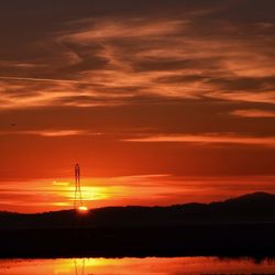 Scenic view of sunset over river