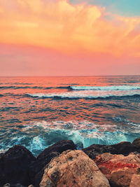 Scenic view of sea against sky during sunset