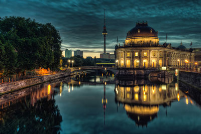Reflection of illuminated buildings in water at night
