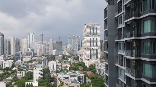 Buildings in city against sky