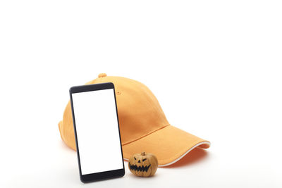 Close-up of smart phone against white background