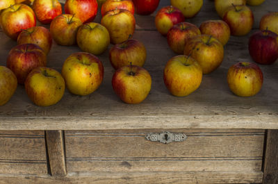Close-up of apples on wood