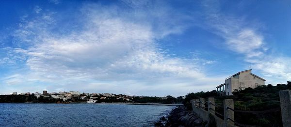 Built structure against blue sky and clouds