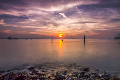 Beautiful golden sunset with soft water	
