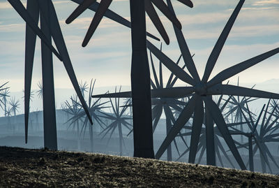 Windmills dot the california mountainside near mojave desert