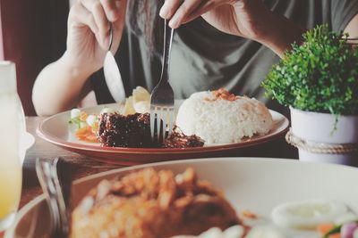 Close-up of man having food