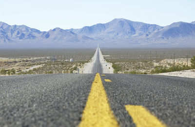 Surface level of road against mountain range