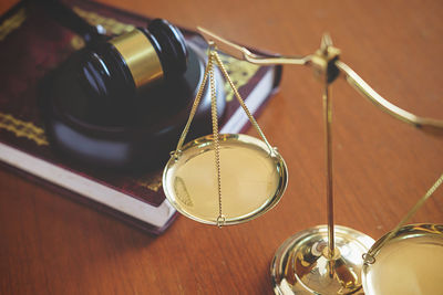 Close-up of gavel at desk in office