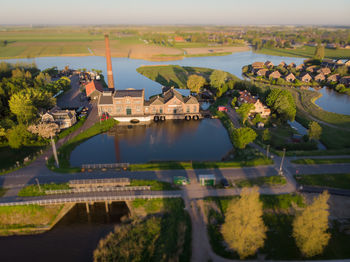 Reflection of trees and buildings in water