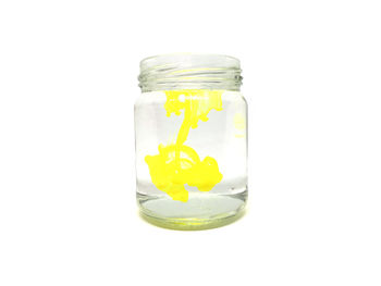 Close-up of jar against white background