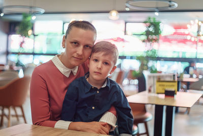 Portrait of young man sitting in cafe