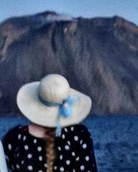 Rear view of woman wearing hat