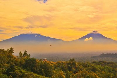 Scenic view of mountains against sky during sunset