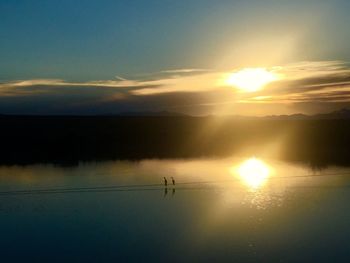 Scenic view of sunset over lake