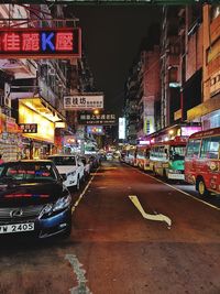 Illuminated city street at night