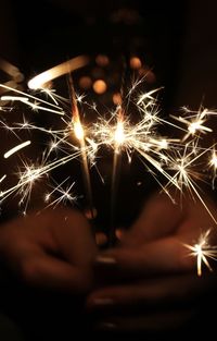 Close-up of sparkler at night