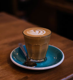 Close-up of coffee cup on table