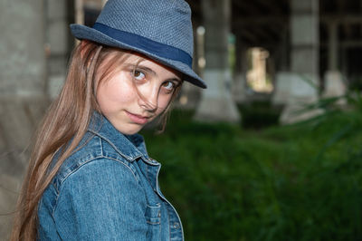 Portrait of a teenage girl in the industrial zone.