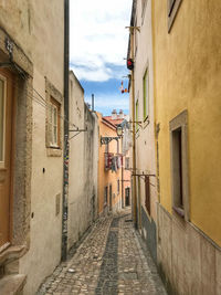 Narrow alley amidst buildings in town