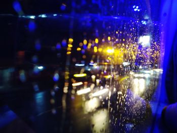 Defocused image of illuminated city street at night